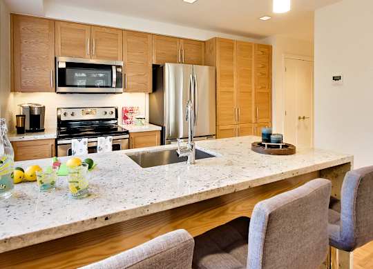a kitchen with a granite counter top and a sink