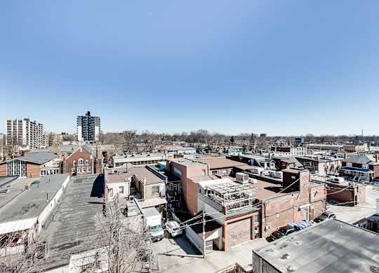 A cityscape with buildings and cars.