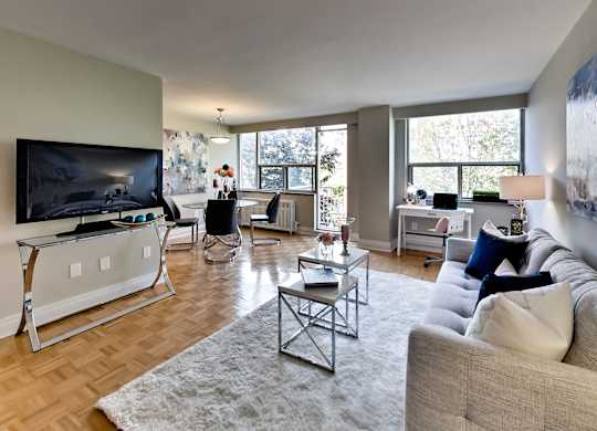 an open living room with a couch and a tv