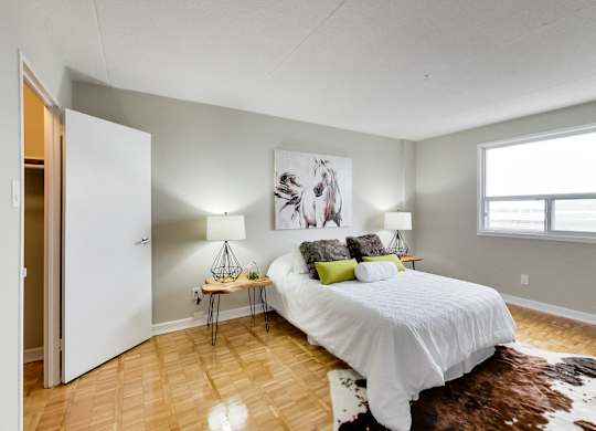 a bedroom with a bed and a window