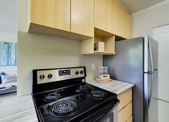 a kitchen with a stove and a refrigerator