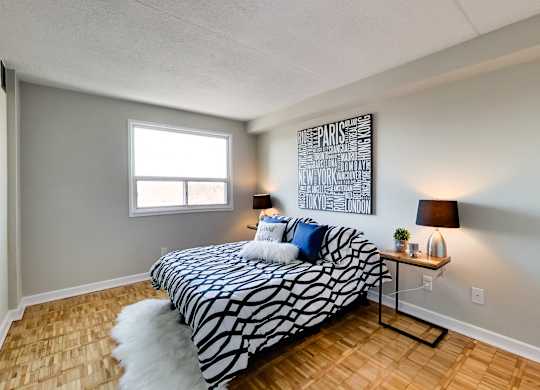 a bedroom with a bed and a futon in it