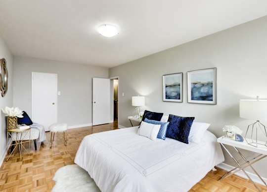 a patient room with two beds and a sign on the wall