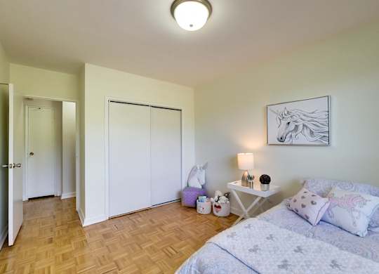 a bedroom with a bed and a closet