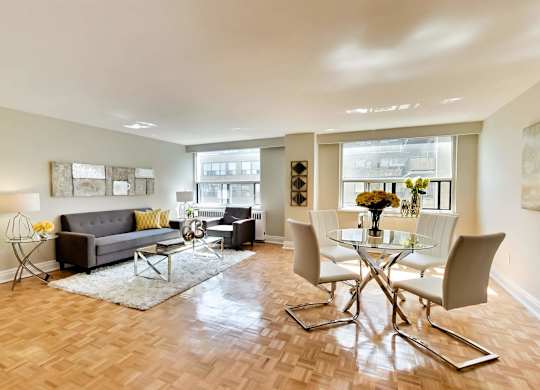 a living room with a table and chairs and a couch