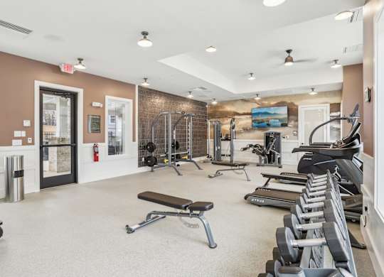 a 24-hour fitness center with free weights and benches