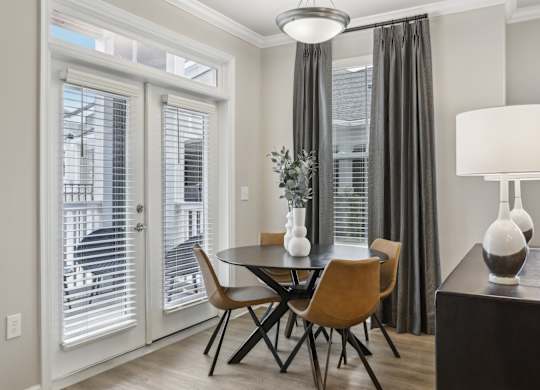 a separate dining space with a chandelier