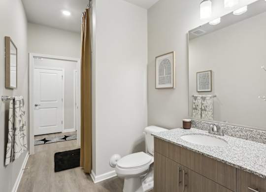 a spacious bathroom with a tub and walk-in closet