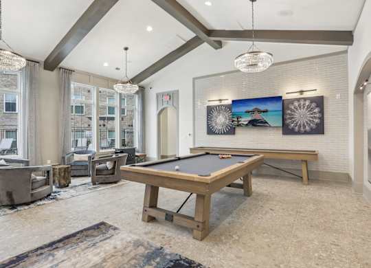 a game room with a pool table and shuffleboard