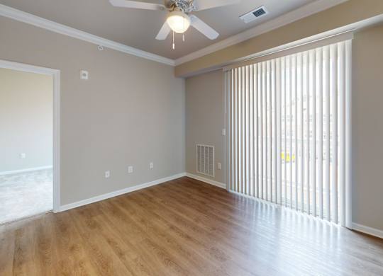 a living room with patio balcony access