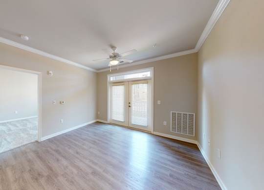 a living room with balcony access