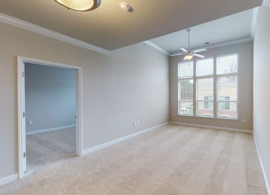 Living room and sunroom with ceiling fan