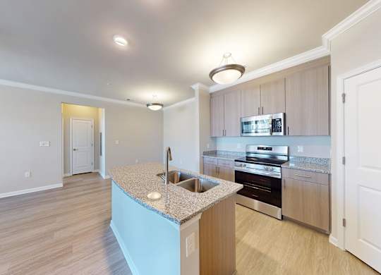 a open concept designer kitchen with granite countertops and stainless steel appliances