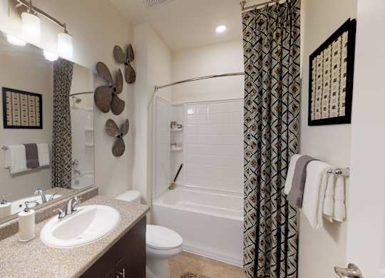 Bathroom with sink, toilet, shower and tub