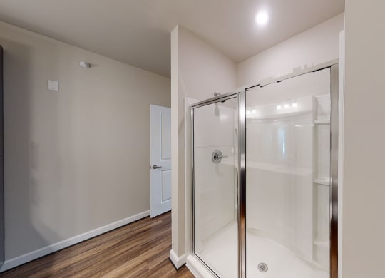 Bathroom with shower and vinyl floors