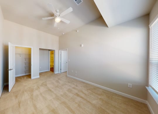 Bedroom with carpet, closet, ceiling fan