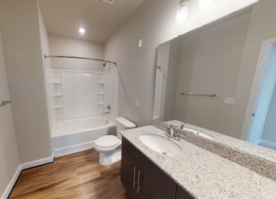 Bathroom with sink, toilet, shower and tub