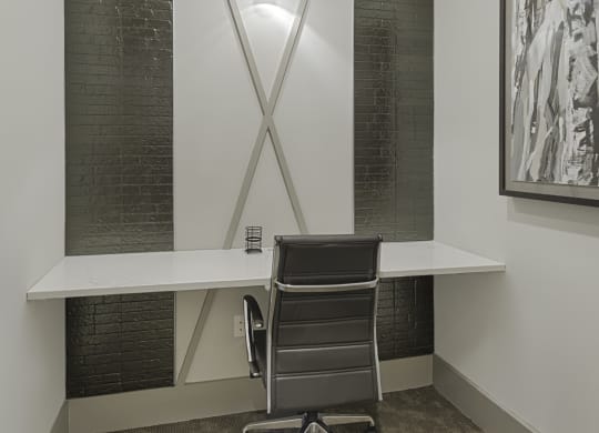 Work space in clubhouse with desk and sliding door