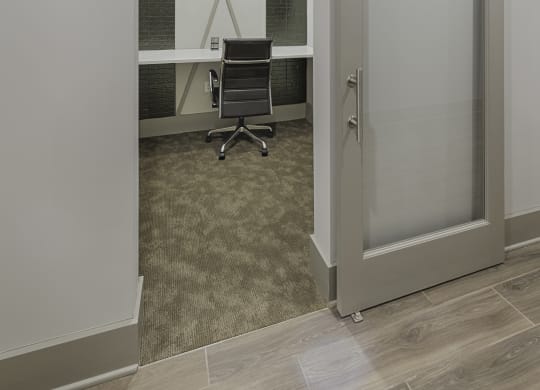 Work space in clubhouse with desk and sliding door
