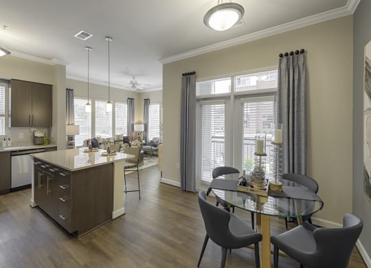 Dining area open to kitchen; door to patio or balcony