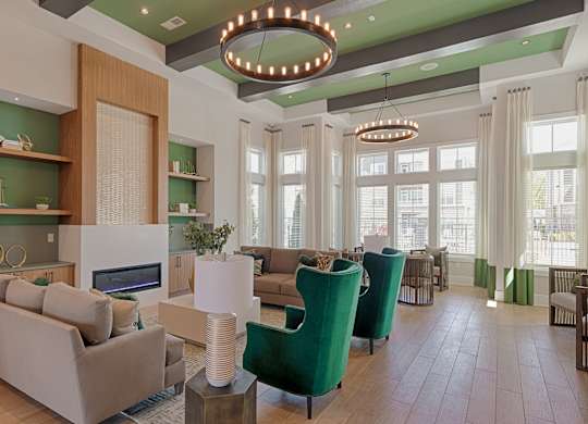 A modern living room with a fireplace and a large window.