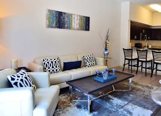 A living room with a white couch and a coffee table.