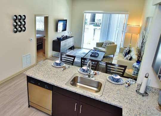 A kitchen with a sink and a counter.