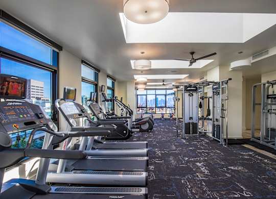 A gym with treadmills and exercise equipment.