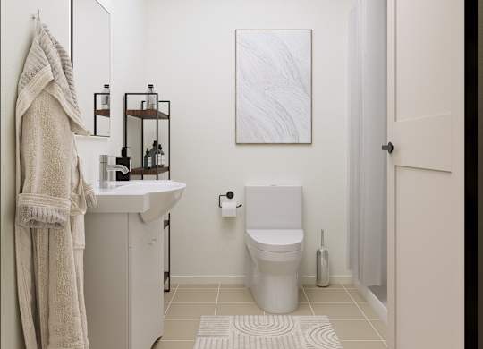 A bathroom with a towel hanging on the wall.