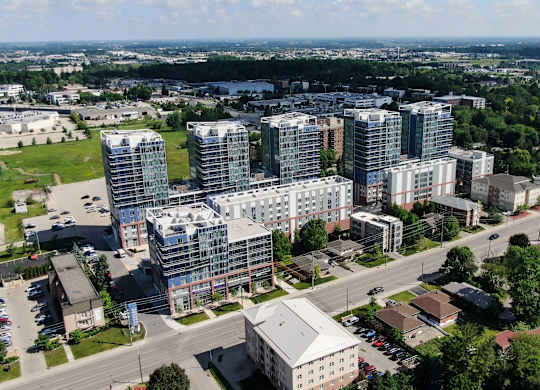 an aerial view of a city with tall buildings