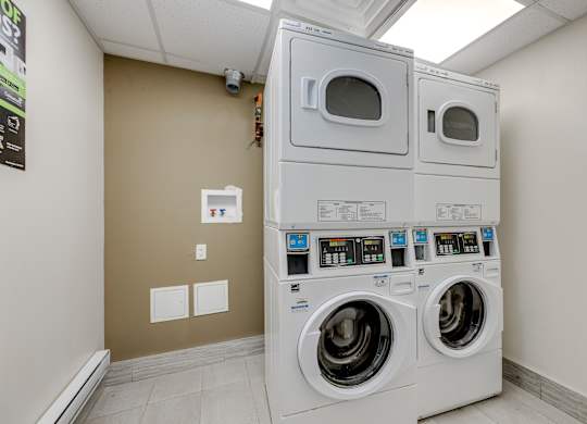 A row of washing machines in a laundromat.