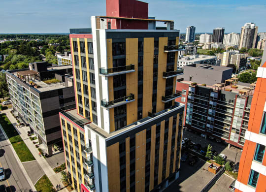 a tall building with a city in the background
