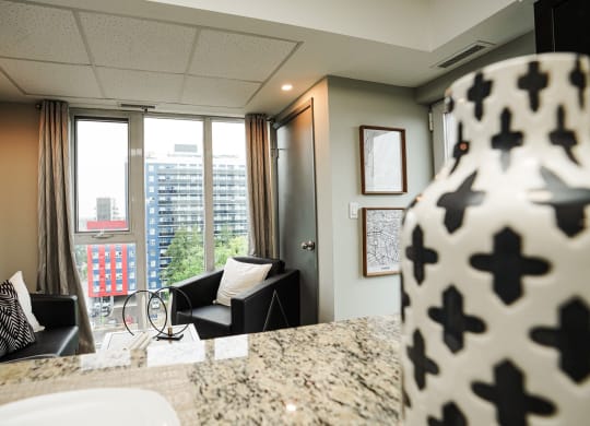 a view of a living room from a kitchen in a hotel room