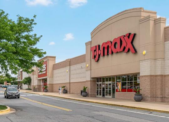 A T.J. Maxx store is shown with a clear blue sky in the background.
