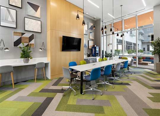 a conference room with a long table and chairs
