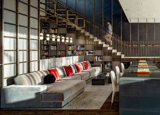 1000 South Capitol's lobby with couches and a table and a staircase.