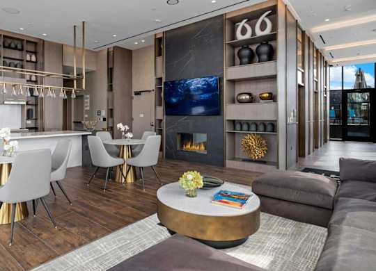1000 South Capitol's rooftop lounge with a catering kitchen, tables, and a couch.
