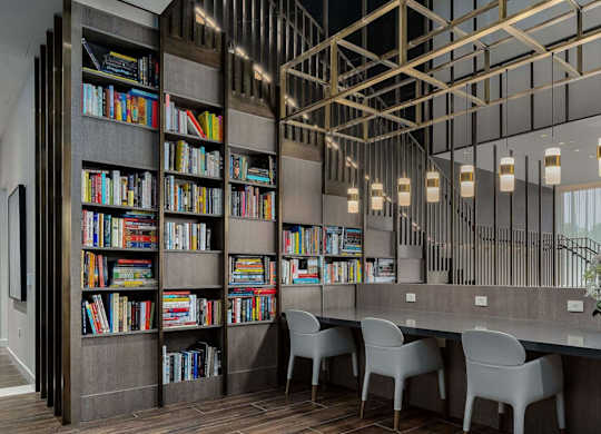 1000 South Capitol's lobby library with individual seating and books on shelves.