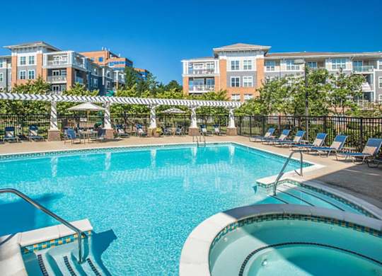 the swimming pool at the preserve at polo towers apartments tx