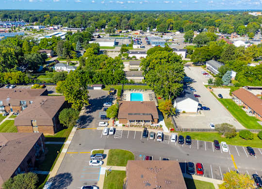 Aerial view with Pool at Knottingham Apartments in Clinton Township, MI