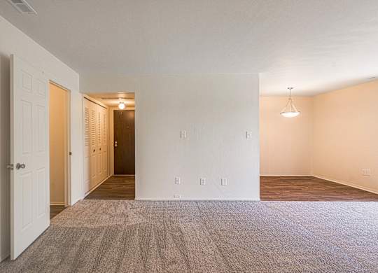 Spacious living and dining room area at Knottingham Apartments in Clinton Township, MI