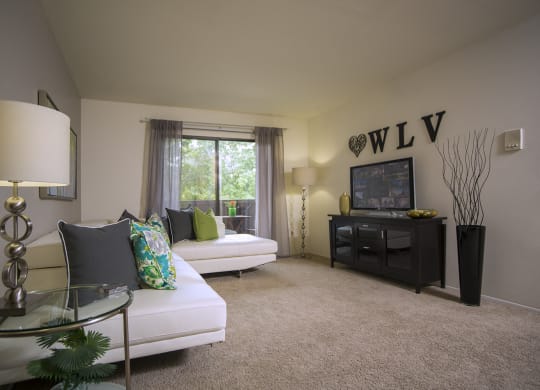 Spacious living room at Woodland Villa Apartments in Michigan