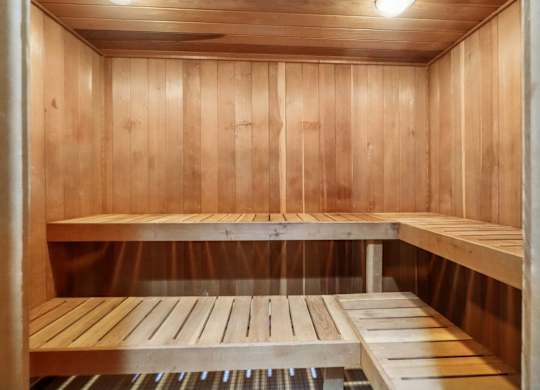 Dry sauna in fitness and wellness center at Drawbridge Apartments in Harrison Township, MI.