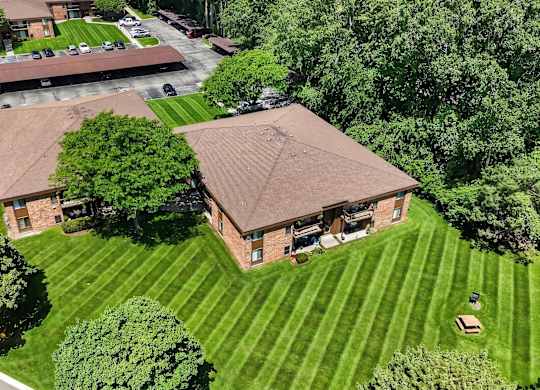 Lush green yard at Eastwood Village Apartments in Clinton Township, MI.