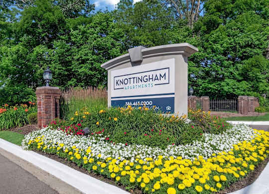 Welcoming entrance at Knottingham Apartments in Clinton Township, MI.