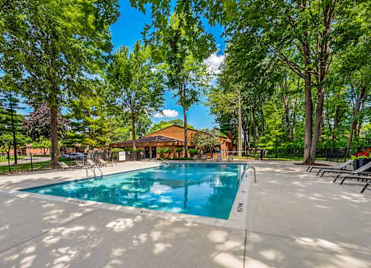 Heated swimming pool with sundeck at Eastwood Village Apartments in Clinton Township, MI.