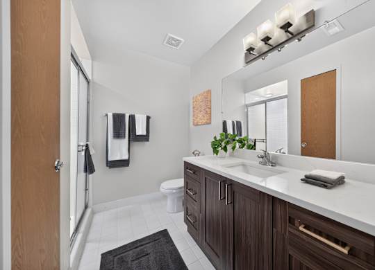 Bathroom with ample storage at Franklin River in Southfield, MI.