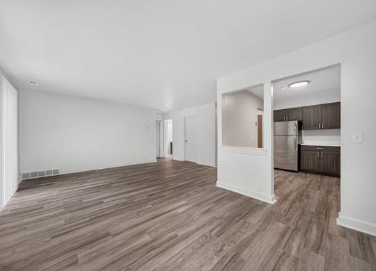 Open and airy living and dining room at Franklin River Apartments in Southfield, MI.