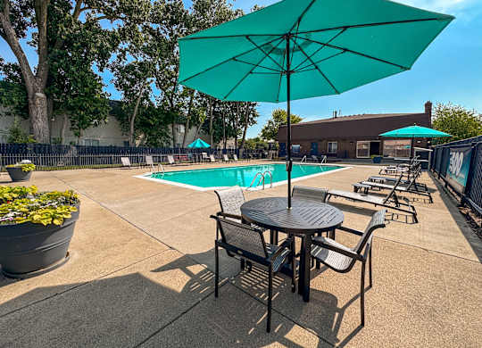 Heated pool and fenced in sundeck at Knottingham Apartments in Clinton Township, MI.