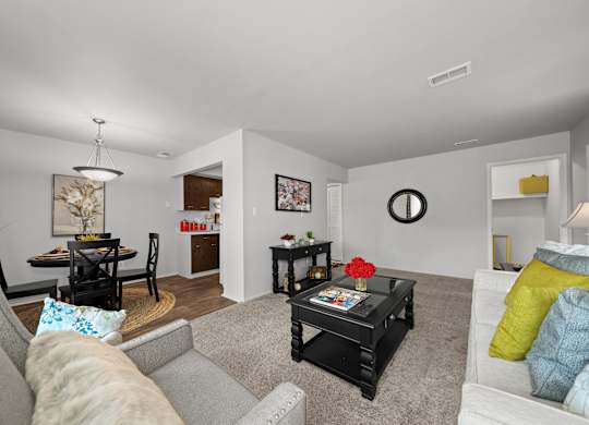 Open and airy living room with natural lighting at Knottingham Apartments in Clinton Township, MI.